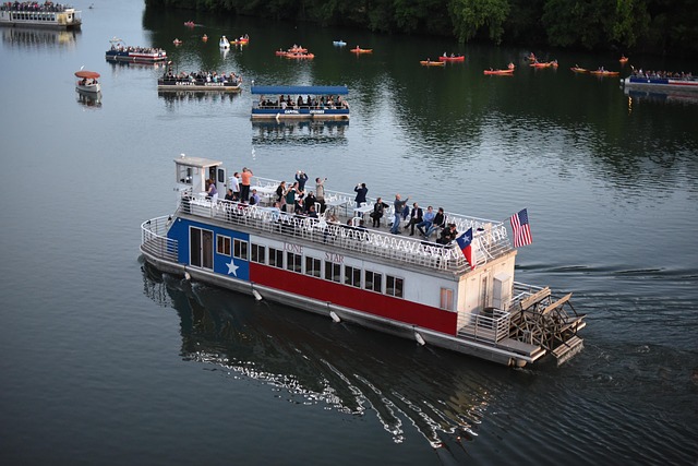 Austin travel guide image of a riverboat on Lady Bird Lake with kayaks, paddleboards, and waterfront views
