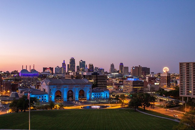 Kansas City travel guide image of the downtown skyline at sunset with Union Station in the foreground