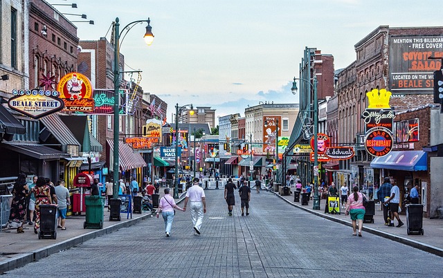 Memphis travel guide image of Beale Street with neon signs, restaurants, music venues, and downtown nightlife
